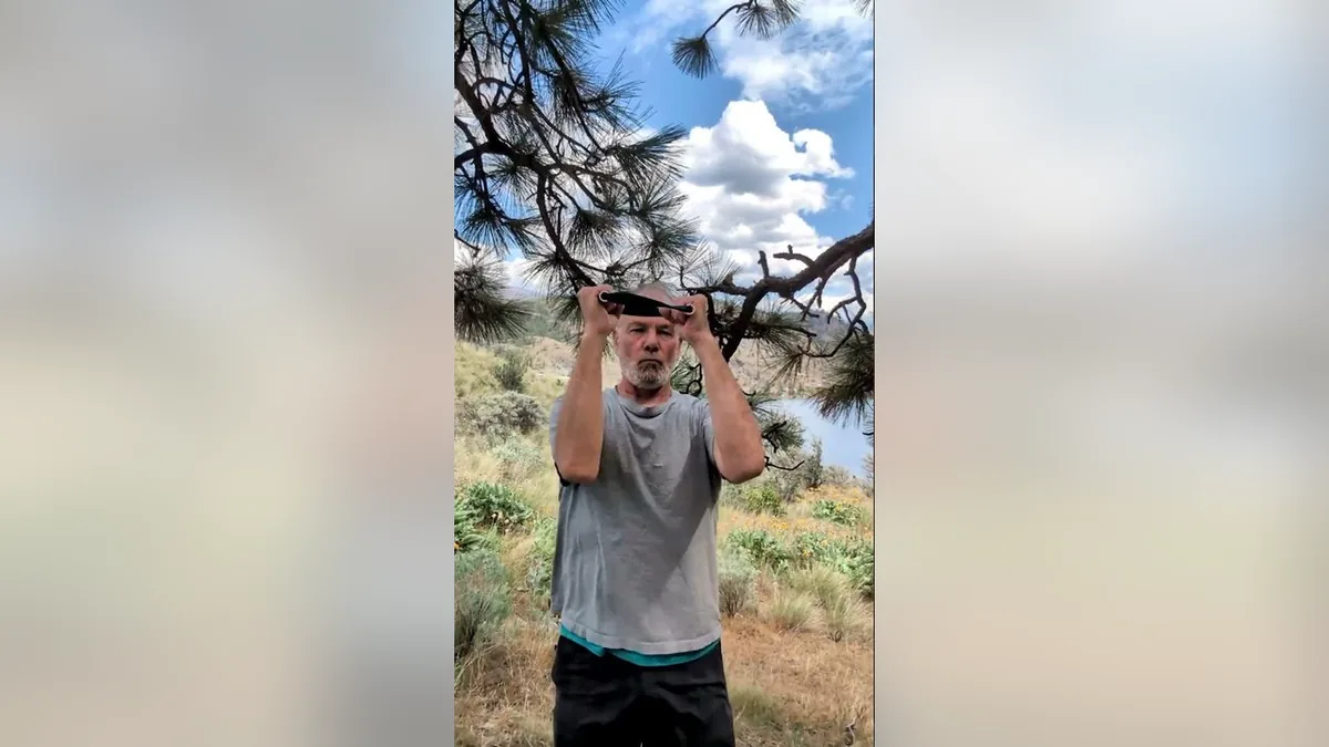 Van demonstrating the Windshield Wipers.Jpg movement with the ShoulderBack Pro outdoors — a frame from the routine video