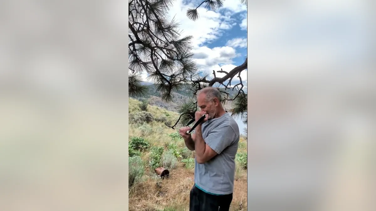 Van demonstrating the Bicep Tricep.Jpg movement with the ShoulderBack Pro outdoors — a frame from the routine video